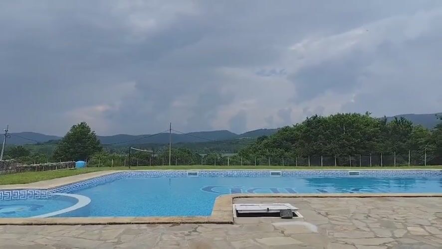 Cloudy day at outdoor pool in Brachkovtsi, Bulgaria