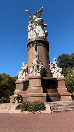 Afternoon street life documented around Buenos Aires monument
