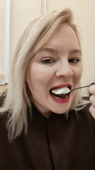 Woman enjoys layered cake breakfast in Izhevsk home