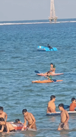 Sanur Beach buzzing with activity on a clear Bali morning