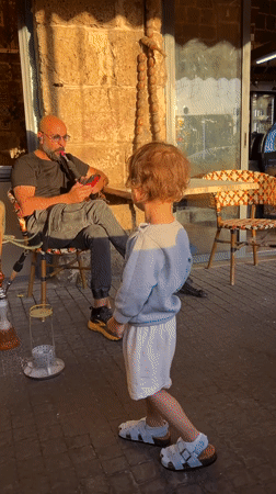 Golden hour cafe scene captured in Acre, Israel