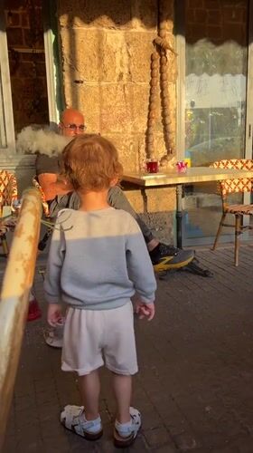 Golden hour cafe scene captured in Acre, Israel