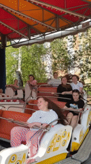 Woman documents afternoon sightseeing tour through Izhevsk, Russia landmarks