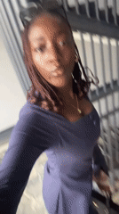 Woman films herself on staircase in Karum, Nigeria