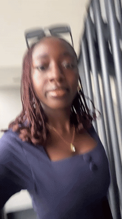 Woman films herself on staircase in Karum, Nigeria