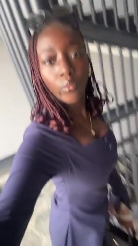 Woman films herself on staircase in Karum, Nigeria