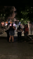 Tel Aviv street nightlife, bars full, chairs being cleared