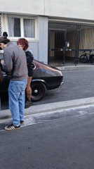 Street gatherings observed around vehicles in Paris morning