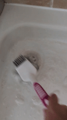 Scrubbing down a bathtub in Telford