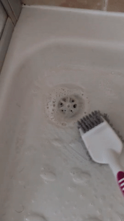 Scrubbing down a bathtub in Telford