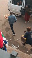 Urban street vendors and pedestrians captured during afternoon hours