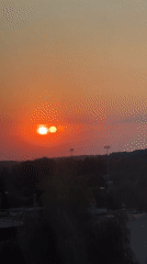 Lublin sunset with multi-orb optical effect, late summer evening