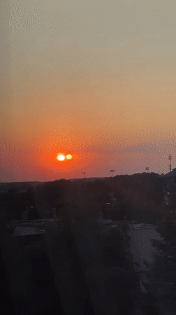 Lublin sunset with multi-orb optical effect, late summer evening