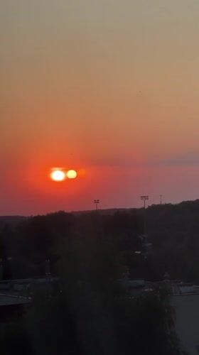 Lublin sunset with multi-orb optical effect, late summer evening