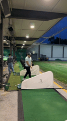 Evening golf practice session documented at Burnaby driving range