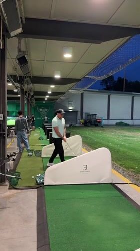 Evening golf practice session documented at Burnaby driving range