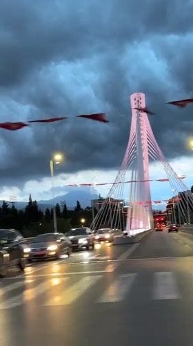 Rainy evening drive past Millennium Bridge in Podgorica captured