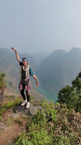 Tourists pose for photos at scenic Meo Vac viewpoints