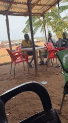 Men gather for casual meeting in Kurunduma, Nigeria