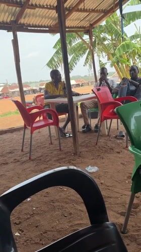 Men gather for casual meeting in Kurunduma, Nigeria
