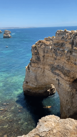 Kayaking through a sea arch on Portugal's Algarve coast