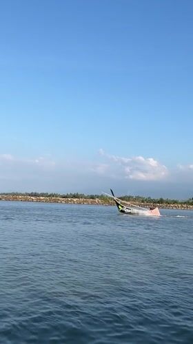 Colorful traditional fishing boats on the water at Meunasah Jurong