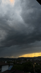 Dramatic storm clouds meet golden sunset over Kardzhali, Bulgaria