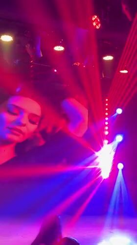 Nightclub event features projected woman's portrait in Yiwu venue