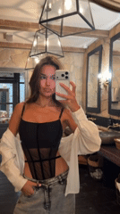 Woman takes mirror selfies in Krasnoyarsk bathroom