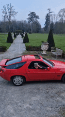 Young driver in red Porsche spotted on gravel road
