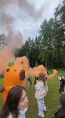 Group gathers with smoke flares and inflatable capybara in Russia