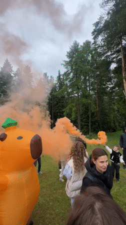 Group gathers with smoke flares and inflatable capybara in Russia