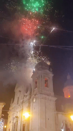 Fireworks over a Sicilian church during a local festival