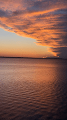 Dramatic sunset captured over water in Kokshetau, Kazakhstan