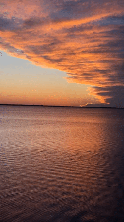 Dramatic sunset captured over water in Kokshetau, Kazakhstan