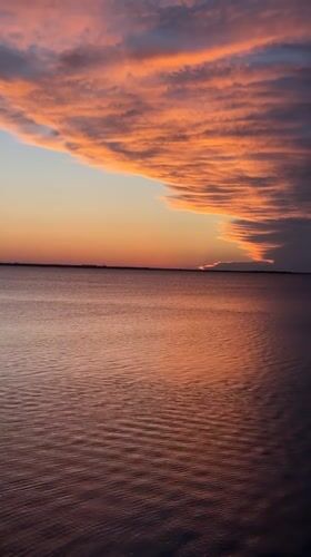 Dramatic sunset captured over water in Kokshetau, Kazakhstan