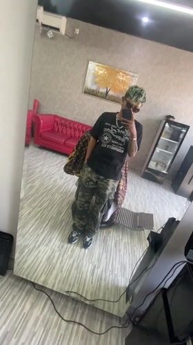 Person takes mirror selfie in Kuta, Indonesia