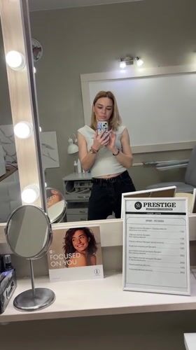 Woman takes selfie at makeup mirror in Vsevolozhsk