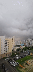 Time-lapse clouds drift over Yekaterinburg apartment skyline