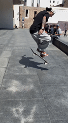 Street performers and skaters enliven sunny Barcelona plaza