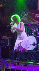 Live band plays colorful outdoor night stage in Barcelona