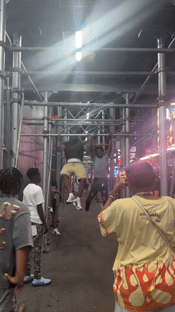 Outdoor pull-up session on metal bars in New York