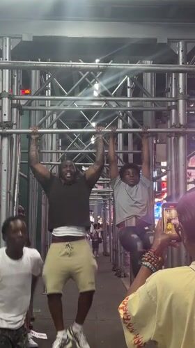 Outdoor pull-up session on metal bars in New York