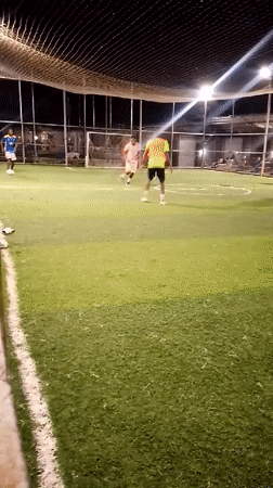 Nighttime soccer match played on artificial turf in Akwanga