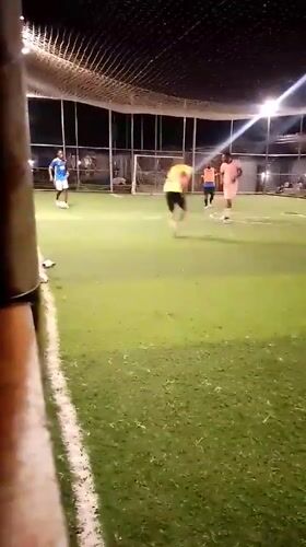 Nighttime soccer match played on artificial turf in Akwanga