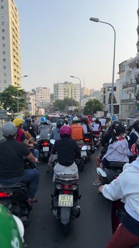 Dense motorbike traffic documented on Ho Chi Minh City street