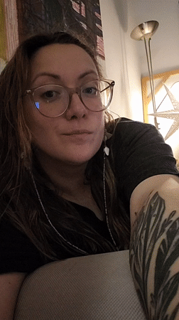 Woman relaxes at home with candles, plants in Budva