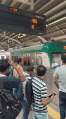 Morning commuters use Dhaka Metro Rail station