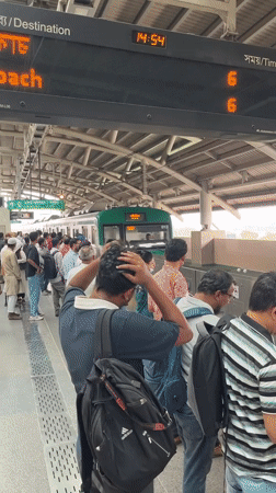 Morning commuters use Dhaka Metro Rail station