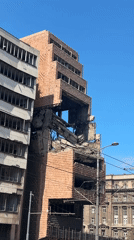 Damaged building with missing facade documented in Belgrade